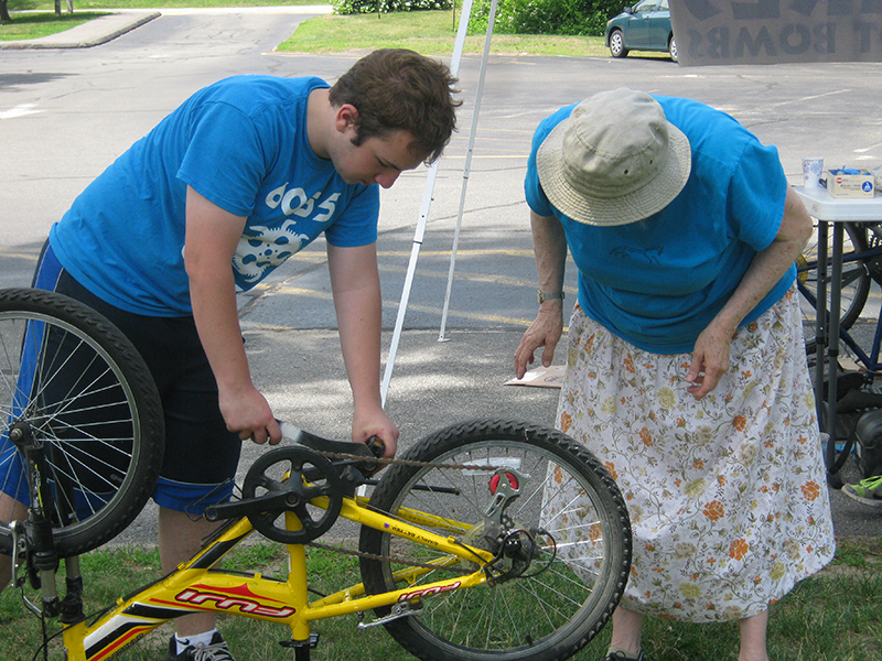 Thom Quirk and Elizabeth Cherniack look over a donation at the Bikes Not Bombs drive.