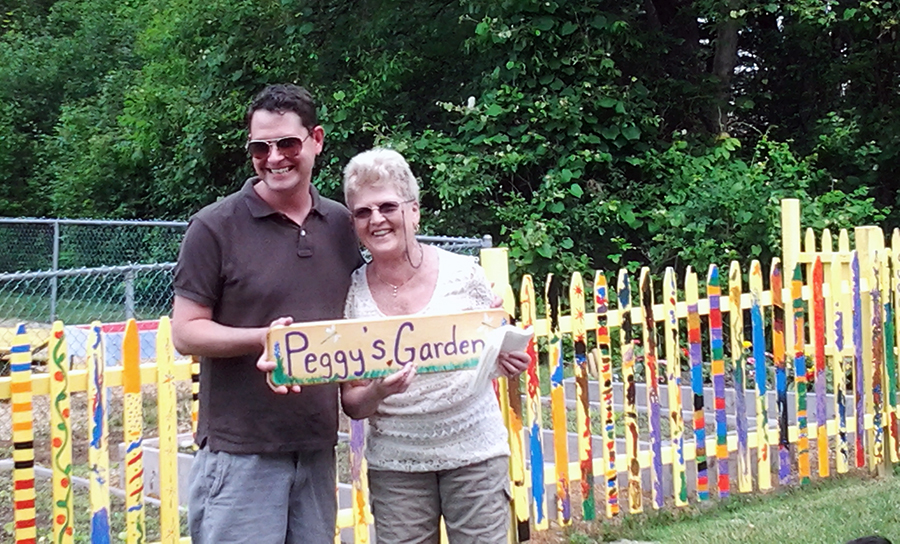 Peggy McSweeney and fellow Magic Garden teacher xxx at "Peggy's Garden" named for the retiring teacher.
